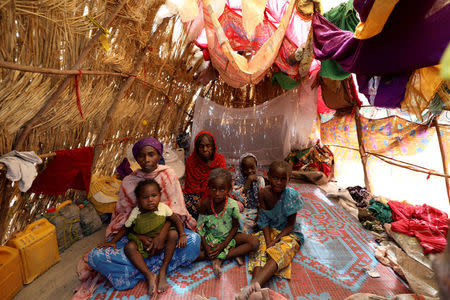 A family is pictured in their straw grass home at the IDP camp at Gamboru, Borno, Nigeria April 27, 2017. REUTERS/Afolabi Sotunde