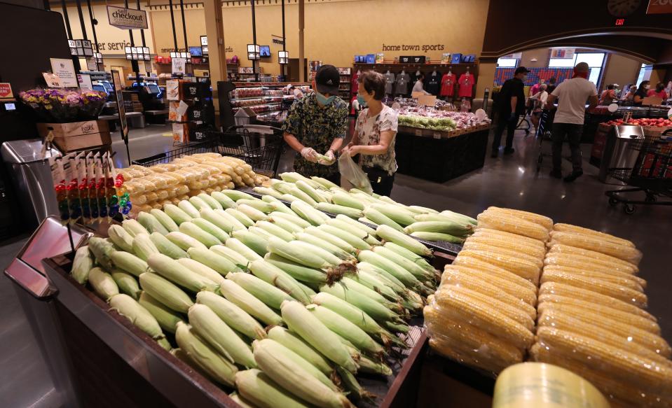 Shoppers in the fruit and vegetable section on opening day in Harrison.