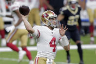 San Francisco 49ers quarterback Nick Mullens (4) passes in the first half of an NFL football game against the New Orleans Saints in New Orleans, Sunday, Nov. 15, 2020. (AP Photo/Brett Duke)