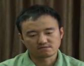 Screen grab of Wang Xiaolu, a financial journalist with the respected business magazine Caijing, confessing on China's main state broadcaster on August 31, 2015