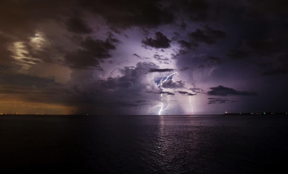 Lightning strikes off of the Sanibel Causeway on July 15, 2019. It is the season as lightning storms pass through the area. 