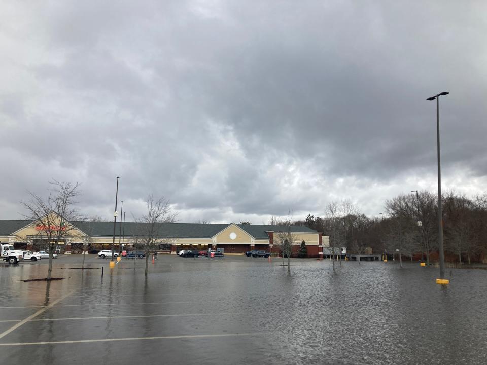 Like the last storm, flooding from the Pawtuxet River spilled over into the parking lot for the Shaws on Warwick Avenue in Warwick. The store was still open on Wednesday morning, but fluttering yellow caution tape blocked off a large portion of the parking lot.