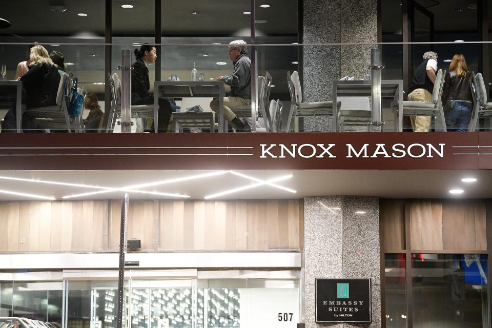 Guests dine on the Knox Mason patio inside Embassy Suites in downtown Knoxville, Tenn. on Friday, March 11, 2022.