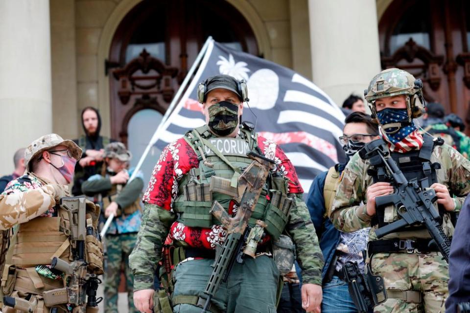 A group tied to the Boogaloo Bois holds a rally at the Michigan state capitol in Lansing, on 17 October 2020.