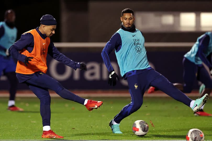 Kylian Mbappe fights for the ball with defender WIlliam Saliba during a France training session in France training for UEFA Euro 2024