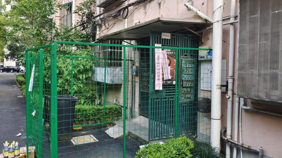 A view of the wire fence installed to keep residents inside a condo building as a measure to curb the spread of Covid-19 in Shanghai, China Tuesday, Apr. 26, 2022