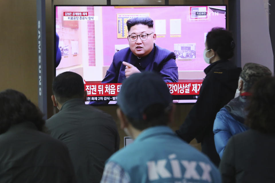 People watch a TV showing a file image of North Korean leader Kim Jong Un during a news program at the Seoul Railway Station in Seoul, South Korea, Saturday, May 2, 2020. Kim made his first public appearance in several weeks as he celebrated the completion of a fertilizer factory near Pyongyang, state media said Saturday, ending an absence that had triggered global rumors that he was seriously ill. (AP Photo/Ahn Young-joon)