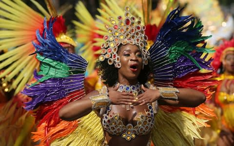 Costumed revellers perform in the Notting Hill Carnival in London, Monday, Aug. 28, 2017.  - Credit: AP Photo/Time Ireland