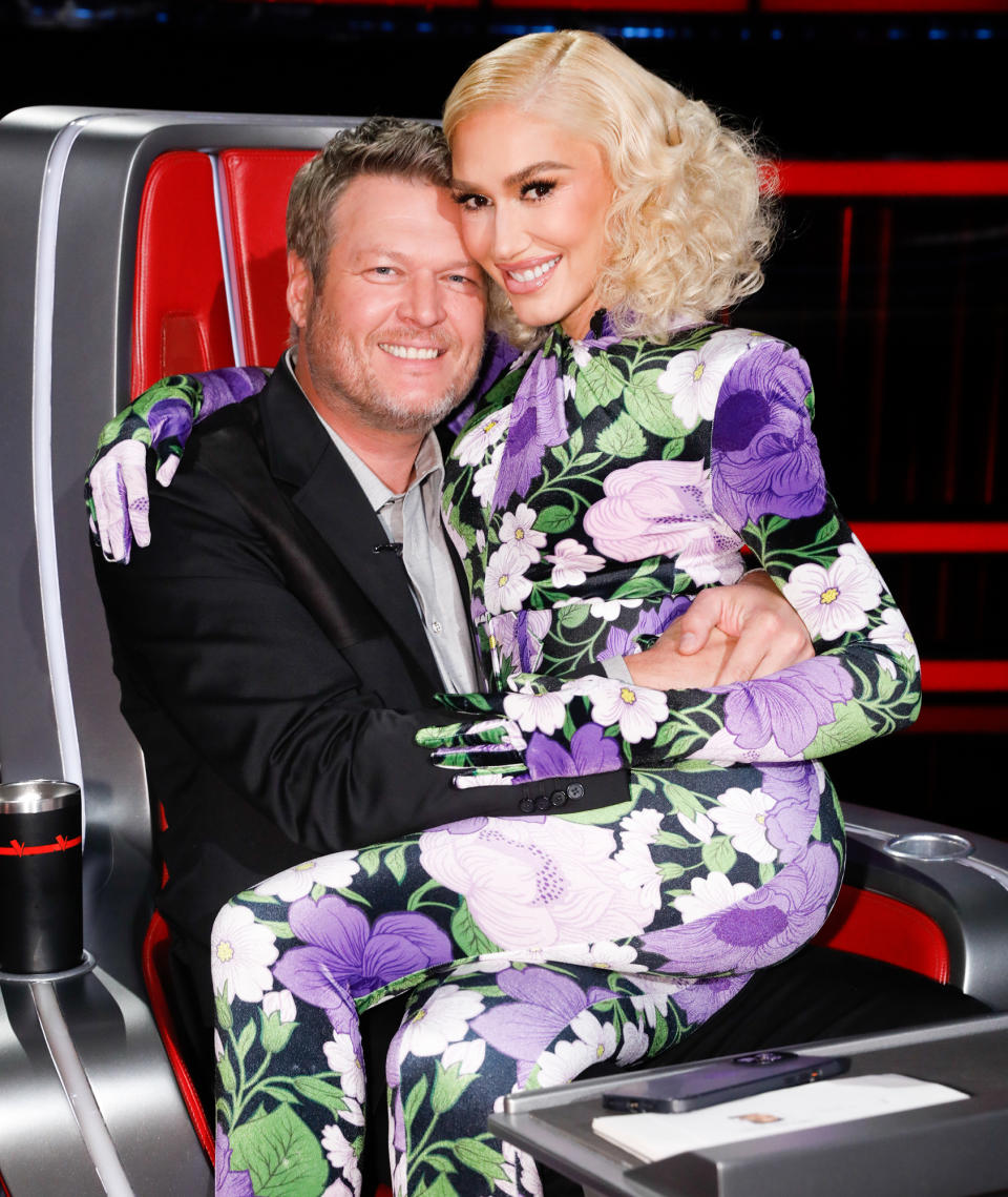 <p>Blake Shelton and Gwen Stefani get lovey-dovey while on the set of <em>The Voice </em>in Los Angeles on Dec. 5. </p>