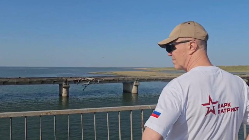 Russian-installed leader of Ukraine's Kherson region Vladimir Saldo pictured in June inspecting the damaged Chonhar bridge (via REUTERS)