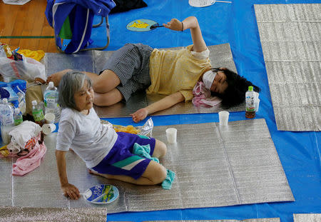 Local residents take rest at Okada elementary school acting as an evacuation center in Mabi town in Kurashiki, Okayama Prefecture, Japan, July 10, 2018. REUTERS/Issei Kato