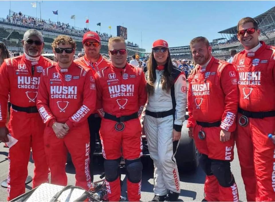 Middletown resident Nicole Rotondo (white suit), a trackside race engineer for Honda Performance Development, with members of the Chip Ganassi Racing team at the 2022 Indianapolis 500.
