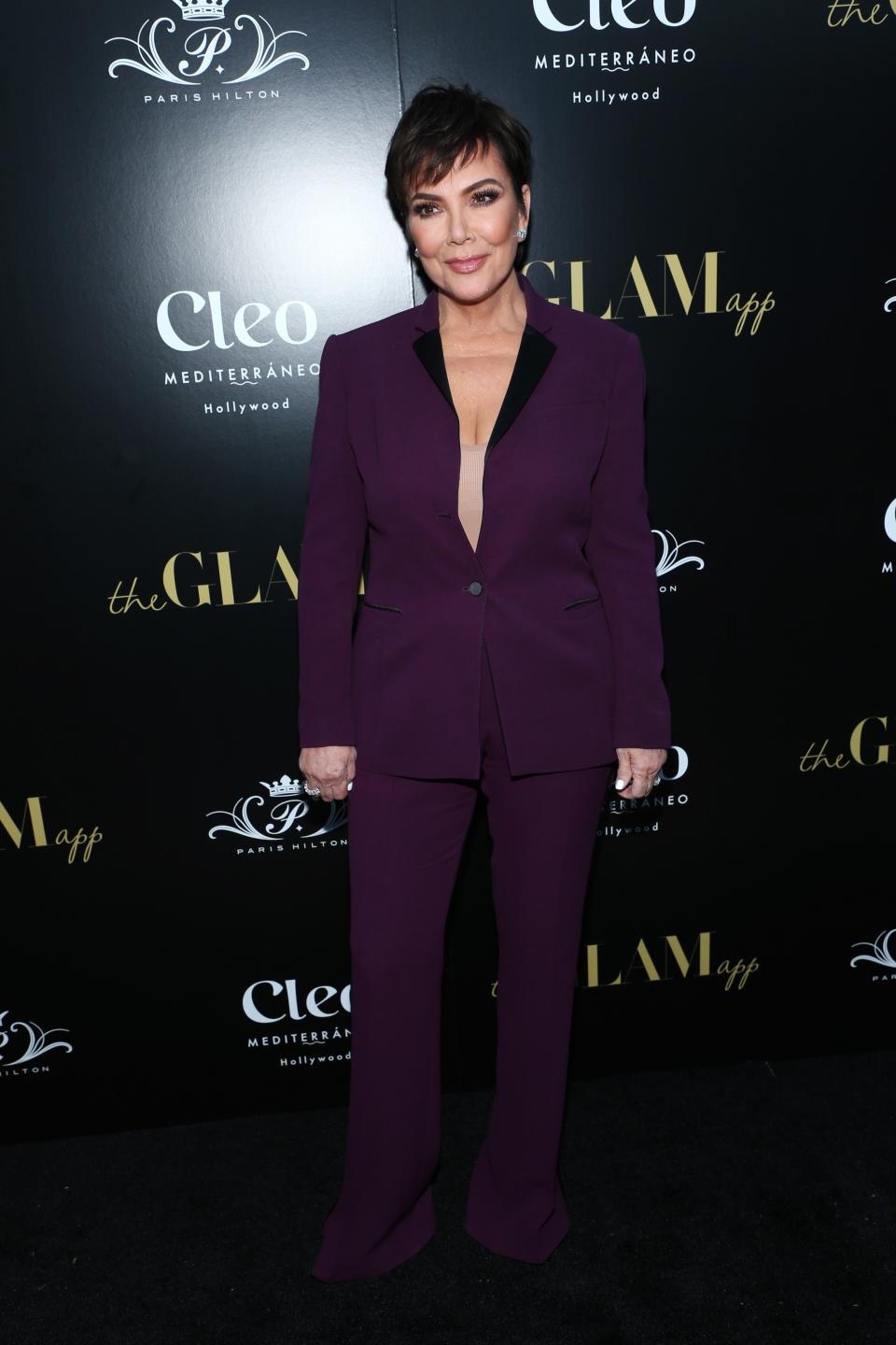 Kris Jenner looks breath-taking in a fashionable purple suit with her stylish low-cut hair.