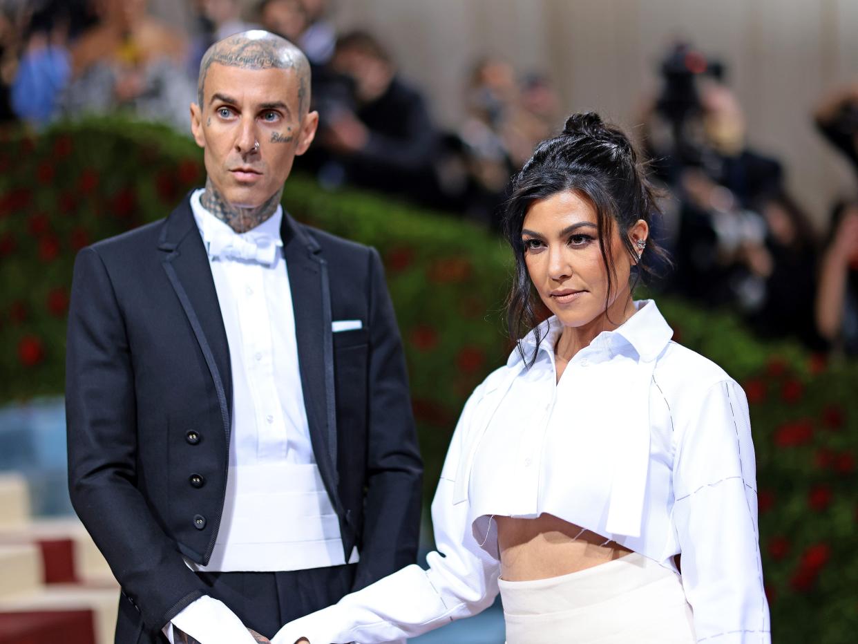 Kourtney Kardashian and Travis Barker attend the 2022 Met Gala.