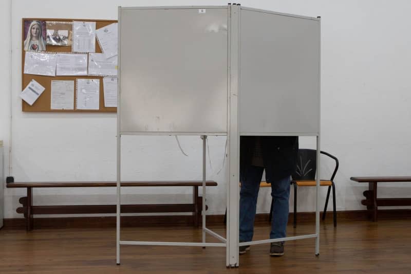 A person prepares his ballot at a polling station at a rural parish for parliamentary elections in Portugal. Cristian Leyva/ZUMA Press Wire/dpa