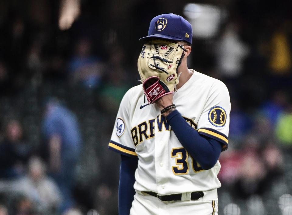 May 27, 2021; Milwaukee, Wisconsin, USA; Milwaukee Brewers pitcher Devin Williams (38) reacts as he walks off the mound after giving up 2 runs in the eighth inning during the game against the San Diego Padres at American Family Field.