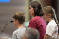 Cheatham County resident Angela Moore, center, speaks against a proposed natural gas plant in her area during a Tennessee Valley Authority Board of Directors listening session Wednesday, May 8, 2024, in Nashville, Tenn. (AP Photo/George Walker IV)