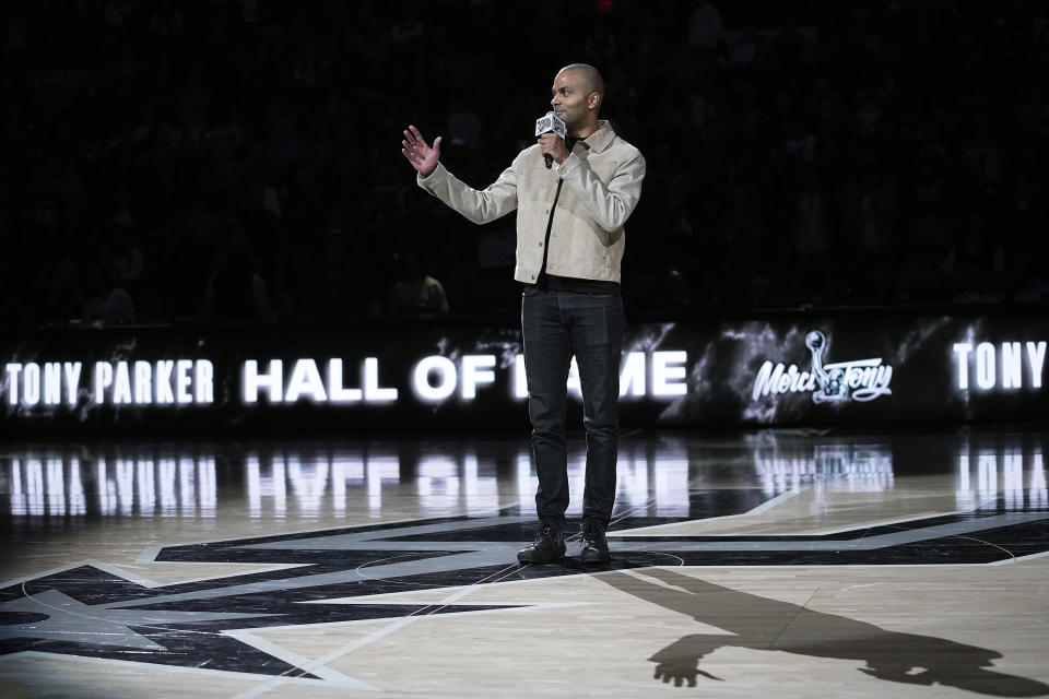 Former San Antonio Spurs guard Tony Parker speaks as he is honored during an NBA basketball game between the Spurs and the New Orleans Pelicans in San Antonio, Sunday, Dec. 17, 2023. (AP Photo/Eric Gay)