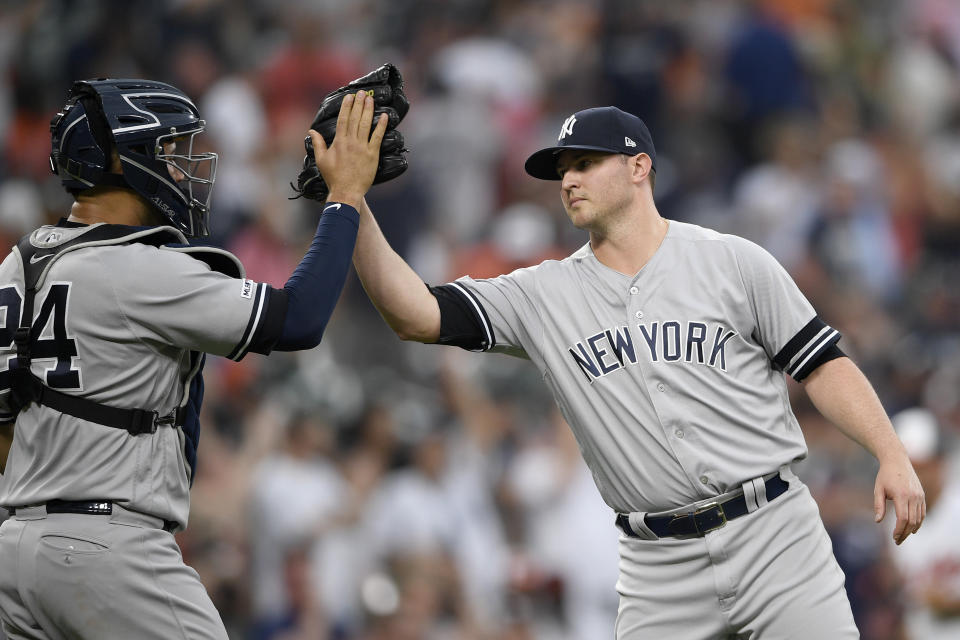 New York Yankees relief pitcher Zack Britton, right, celebrates with catcher Gary Sanchez (24) after a baseball game against the Baltimore Orioles, Thursday, May 23, 2019, in Baltimore. The Yankees won 6-5. (AP Photo/Nick Wass)