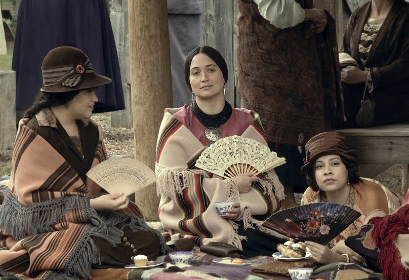 This image released by Apple TV+ shows, from left, JaNae Collins, Lily Gladstone, and Cara Jade Myers in a scene from "Killers of the Flower Moon."