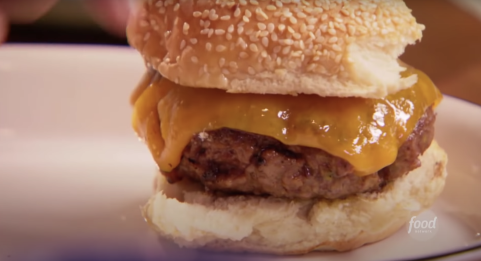 a simple cheeseburger with a fat patty