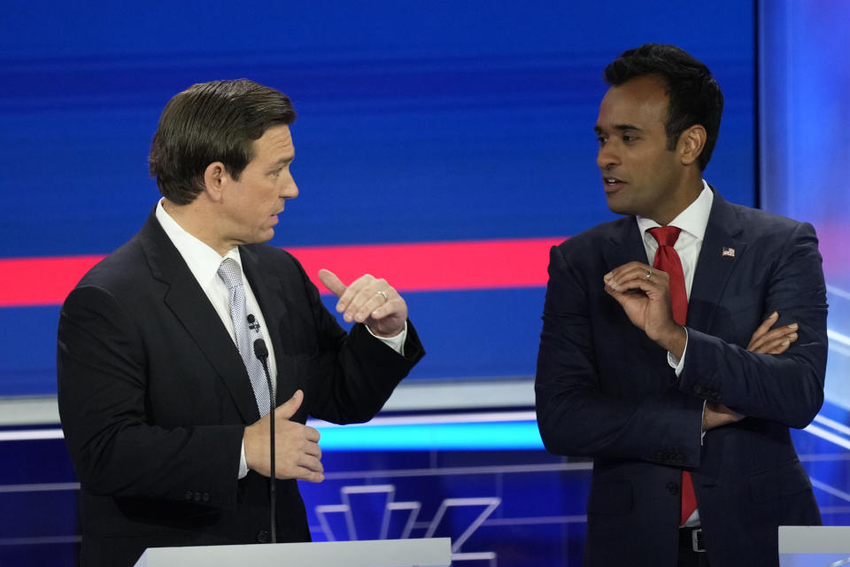 Republican presidential candidate businessman Vivek Ramaswamy talks with Florida Gov. Ron DeSantis during a break at the Republican presidential primary debate hosted by NBC News, Wednesday, Nov. 8, 2023, at the Adrienne Arsht Center for the Performing Arts of Miami-Dade County in Miami. (AP Photo/Rebecca Blackwell)