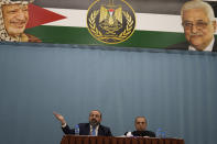 Palestinian Attorney General Akram Al Khateeb, left, and spokesperson for the Palestinian Presidency, Nabil Abu Rudeineh announce the results of the Palestinian investigation into the death of Palestinian-American Al-Jazeera journalist Shireen Abu Akleh, in the West Bank city of Ramallah, Thursday, May 26, 2022. Khateeb said the probe showed Israeli troops intentionally killed her during an army raid in the West Bank city of Jenin. Israel is likely to reject the findings as biased and unfounded. (AP Photo/Majdi Mohammed)