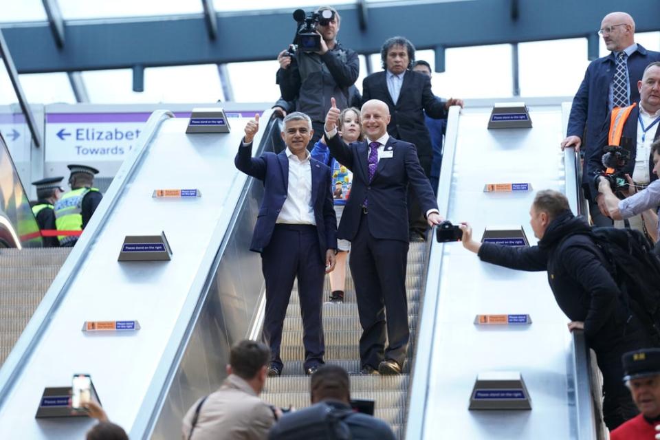 Mr Khan and Andy Byford, Commissioner at Transport for London, gave a thumbs-up as they descended the escalator at Paddington (Kirsty O’Connor/PA) (PA Wire)