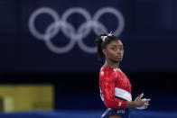 Simone Biles, of the United States, waits to perform on the vault during the artistic gymnastics women's final at the 2020 Summer Olympics, Tuesday, July 27, 2021, in Tokyo. The American gymnastics superstar has withdrawn the all-around competition to focus on her mental well-being. (AP Photo/Gregory Bull)