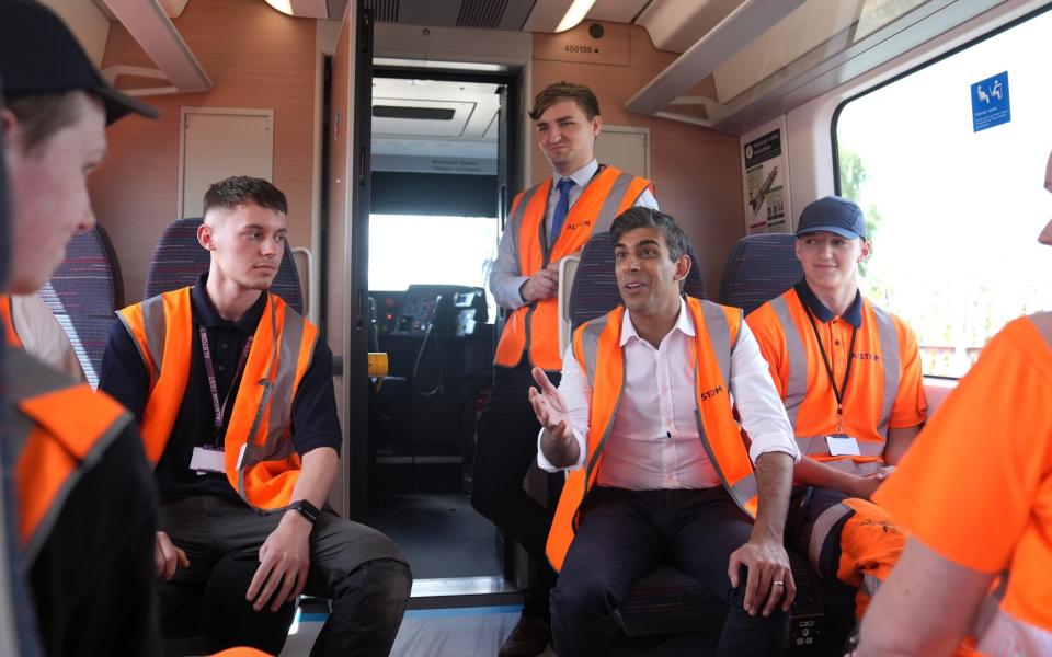 Rishi Sunak talks to apprentices during a visit to Alstom Transport in Derby