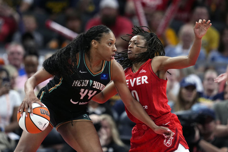 New York Liberty's Betnijah Laney-Hamilton goes to the basket against Indiana Fever's Kelsey Mitchell during the second half of a WNBA basketball game, Saturday, July 6, 2024, in Indianapolis. (AP Photo/Darron Cummings)