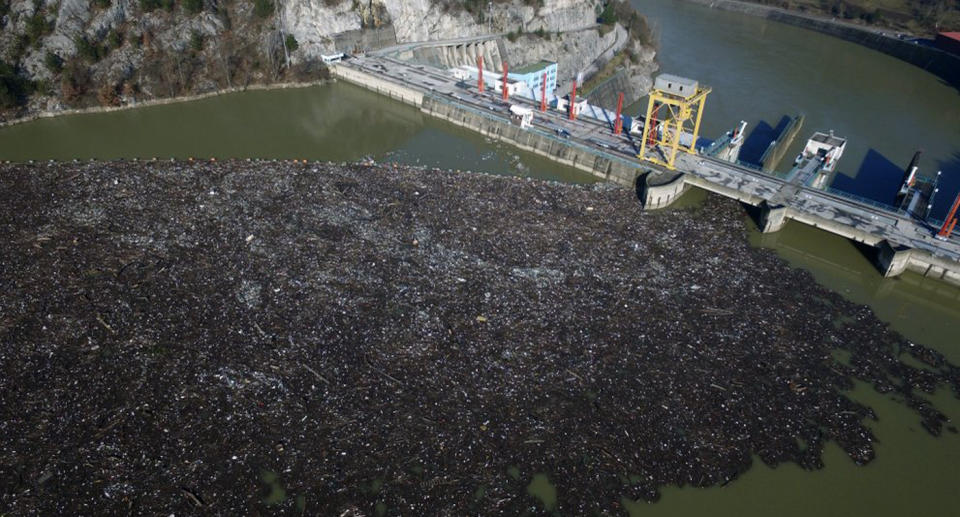 This is aerial photo shows plastic bottles, wooden planks, rusty barrels and other garbage clogging the Drina river near the eastern Bosnian town of Visegrad, Bosnia