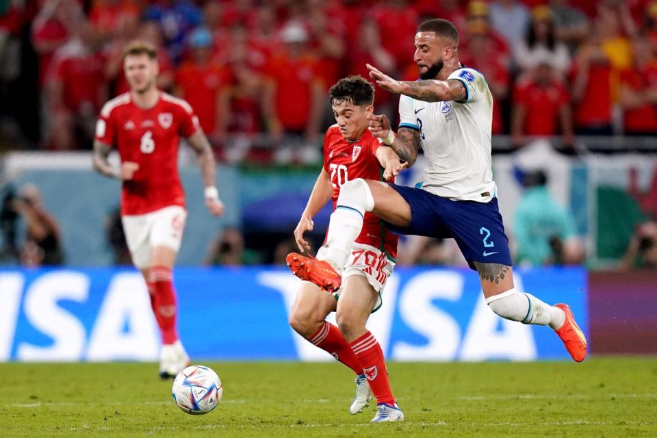 England's Kyle Walker battles for possession of the ball with Wales' Daniel James (PA)