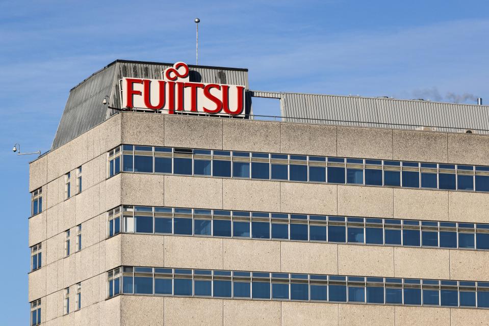 A photograph taken on January 10, 2024 shows the logo of the Japanese multinational information and communications technology equipment and services corporation Fujitsu on the top of their Head Office building, in Bracknell, west of London. Between 1999 and 2015, some 700 Post Office branch managers were prosecuted, sometimes to the point of having their lives shattered, based on information from accounting software called Horizon, installed by Japanese tech giant Fujitsu at the end of the 1990s. A public inquiry into the scandal opened in February 2022 but has yet to examine who at the top of the Post Office knew what and when. Victims hope it will establish who was responsible for Post Office lawyers hounding innocent people through the courts even after credible doubts had been raised about Horizon. (Photo by Adrian DENNIS / AFP) (Photo by ADRIAN DENNIS/AFP via Getty Images)