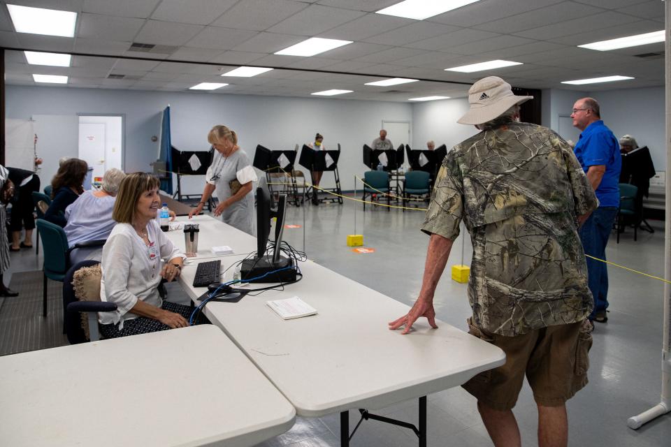 A man is checked into a polling station early voting in Columbia, TN. 