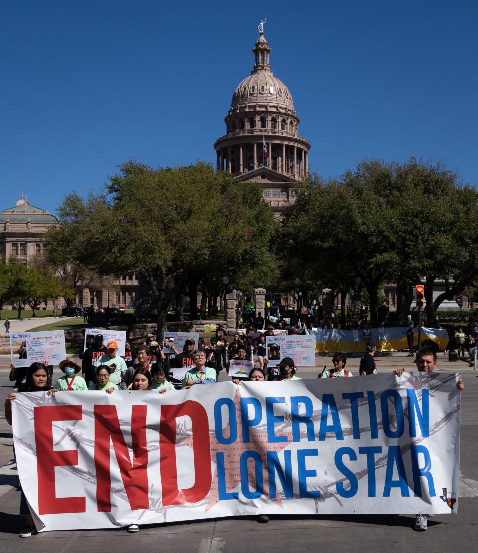 Protesters march from the Texas Capitol to Republic Square park in downtown Austin to call for the immediate end of Operation Lone Star in March.  
(Photo: SARA DIGGINS/AMERICAN-STATESMAN)
