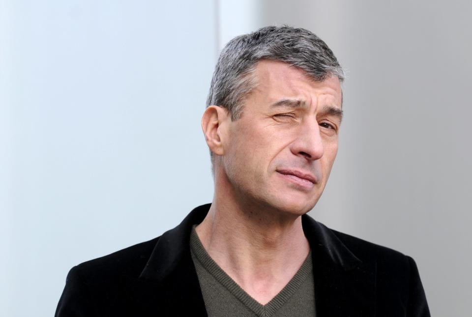 Italian artist Maurizio Cattelan poses Tuesday Jan. 29, 2008 during a press event at the Kunsthaus in Bregenz, Austria, where a exposition of his works will be on display from February 1, to March 24, 2008. (AP Photo/Keystone/Regina Kuehne)