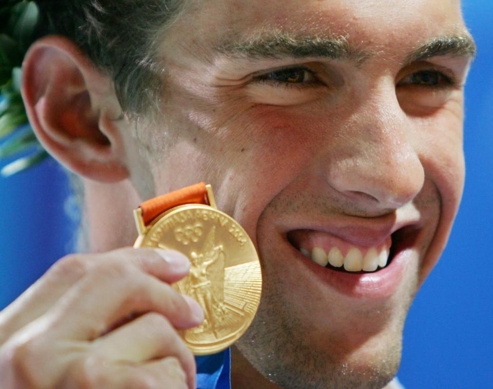 美國的Michael Phelps 在雅典奧運男子200米個人混合式奪金。(圖片來源：達志影像)