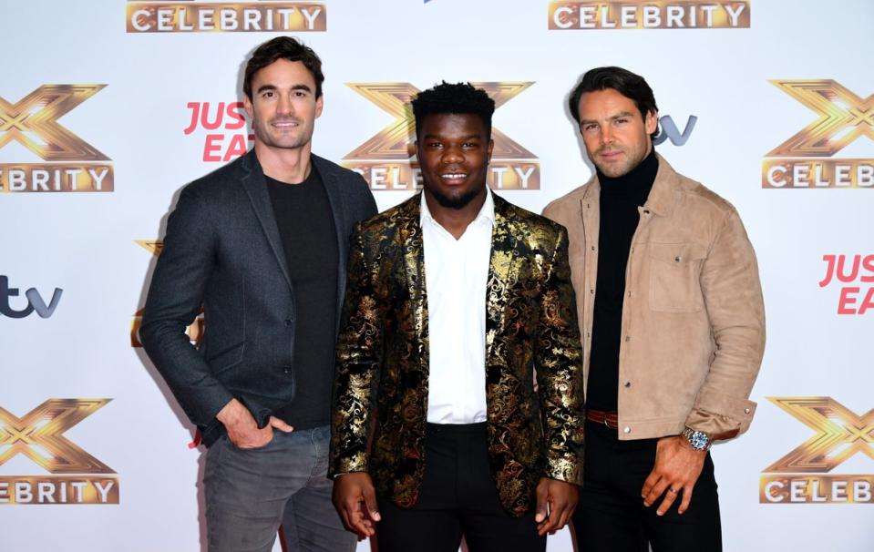 El Sr. Davis (centro) firmó un contrato discográfico después de aparecer en Celebrity X Factor en 2019 (PA)