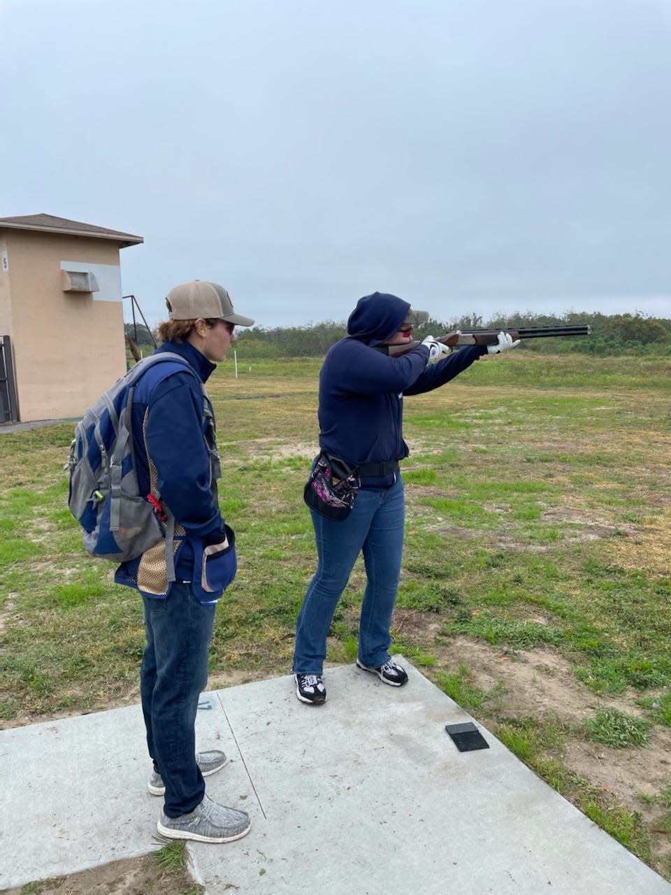 Warner trapshooting team member Bryce Bowman, left, instructs at the first-ever Warner University Mini Trap on Saturday.