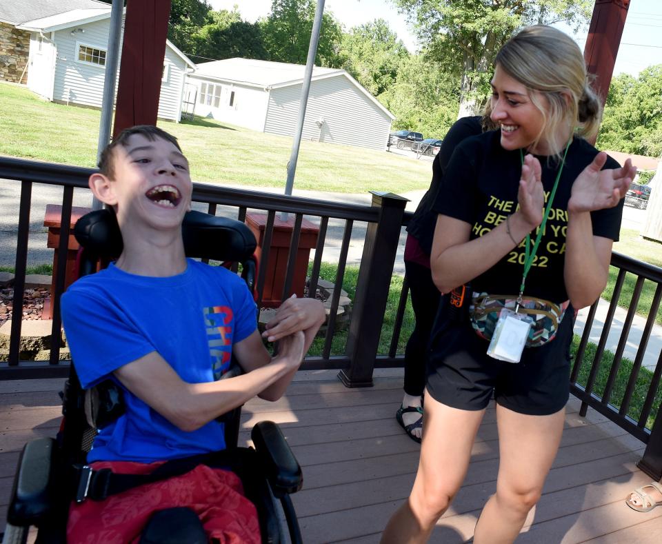 Camper Jackson Feldt, 12, has a blast dancing with camp councilor Priscilla Byrd.