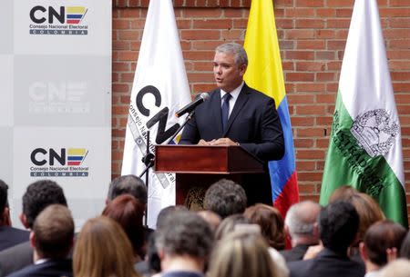 Colombia's President-Elect Ivan Duque addresses the audience after receiving his credentials from the election council, in Bogota, Colombia July 16, 2018. REUTERS/Luisa Gonzalez