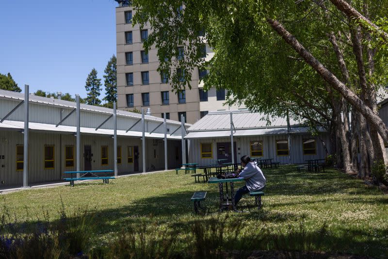 A student sits at the University of California, Berkeley campus