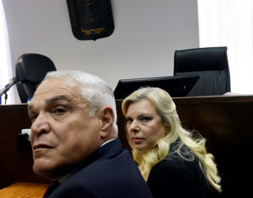 Sara Netanyahu and her lawyer Yossi Cohem wait for the judge to arrive at the Magistrate's Court in Jerusalem on June 16, 2019