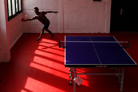 Papua New Guinea table tennis players Goada Elly plays on a table during a practice session at a Beijing-funded facility in central Port Moresby in Papua New Guinea, November 19, 2018. REUTERS/David Gray