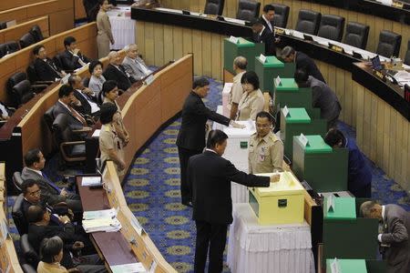 National Legislative Assembly members vote on impeaching ousted former Prime Minister Yingluck Shinawatra, at the Parliament in Bangkok, January 23, 2015. REUTERS/Chaiwat Subprasom