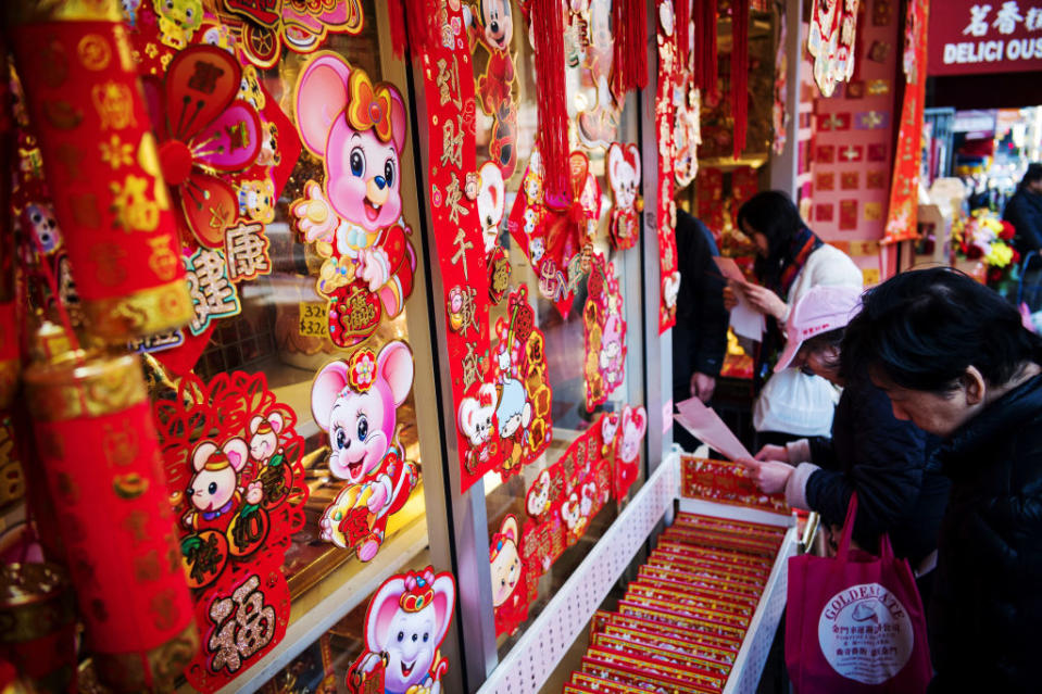 Shoppers browse year of the rat decorations ahead of Lunar New Year in the Chinatown neighborhood of San Francisco, California, U.S., on Wednesday, Jan. 22, 2020. Also known as Chinese New Year or the Spring Festival, it marks the beginning of theÂ lunar calendarÂ and is China's most important holiday, a period that's seen as celebrating values like unity and family ties. Photographer: David Paul Morris/Bloomberg