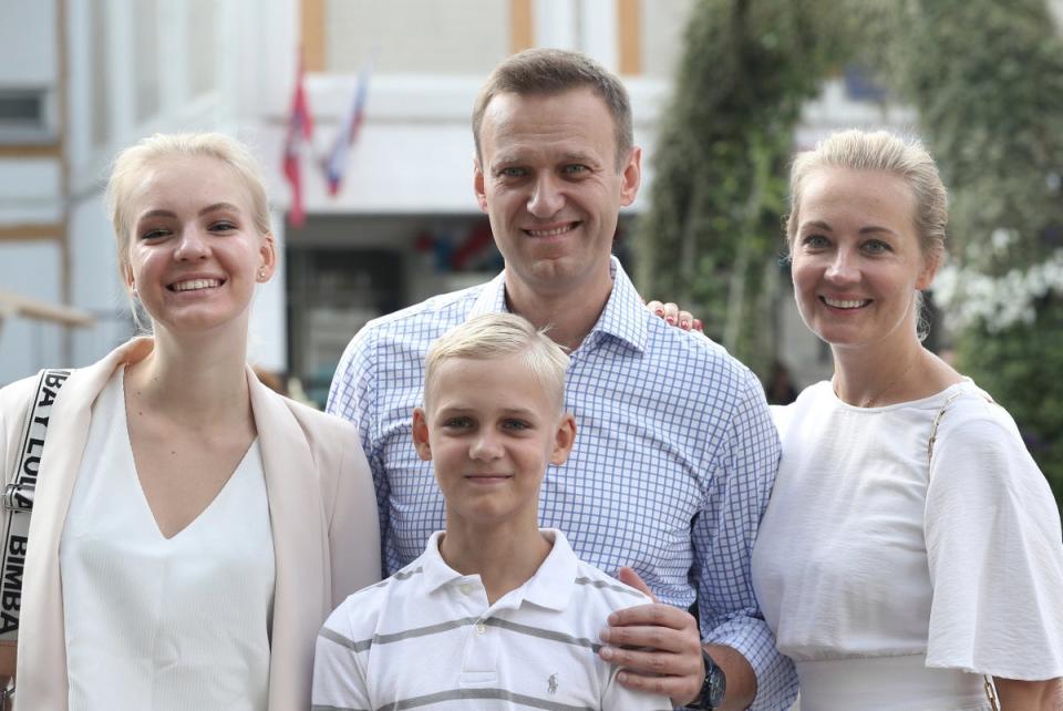 Russian opposition leader Alexei Navalny, with his wife Yulia, right, daughter Daria, and son Zakha in 2019 (AP)