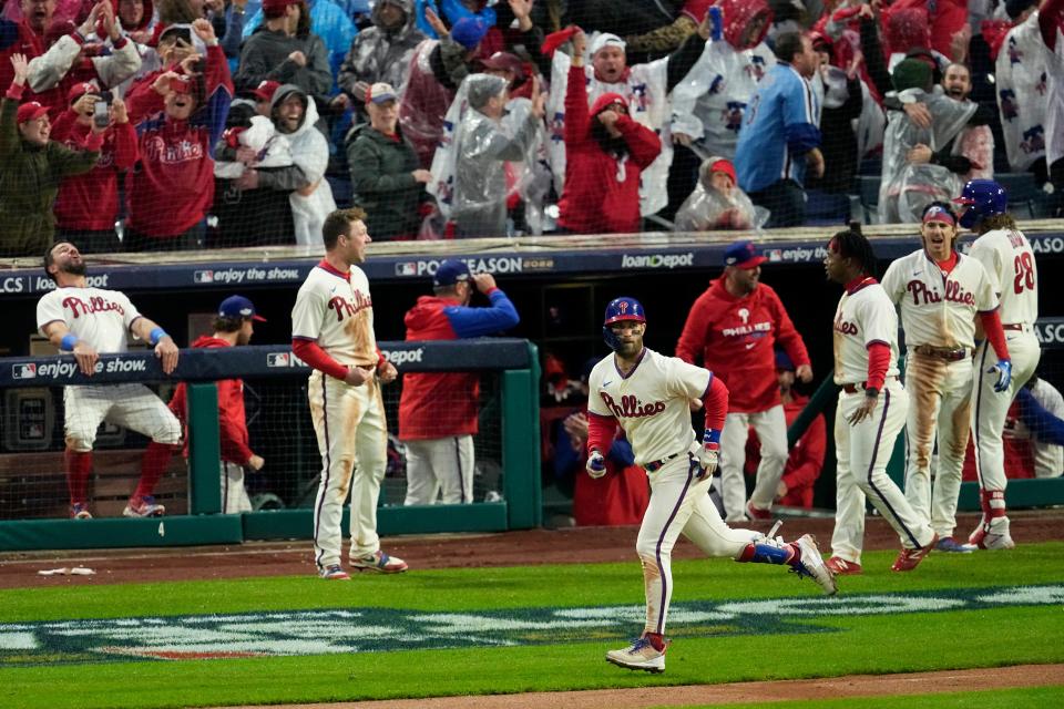 Philadelphia Phillies' Bryce Harper rounds the bases after a two-run home run during the eighth inning in Game 5 of the baseball NL Championship Series between the San Diego Padres and the Philadelphia Phillies on Sunday, Oct. 23, 2022, in Philadelphia. (AP Photo/Matt Rourke)