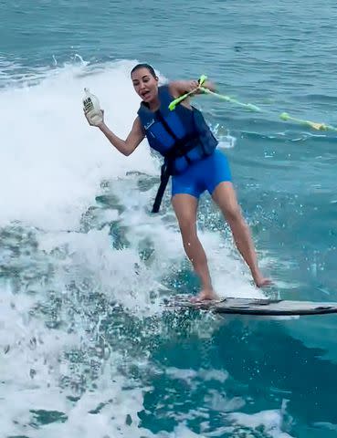 Kim Kardashian Goes Wakeboarding in Skims Swim Cycle Suit